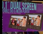 Proscan Elite PEDVD1082 10.1" Dual Screen Portable Media Player - Black New Open. Price: $44.00.